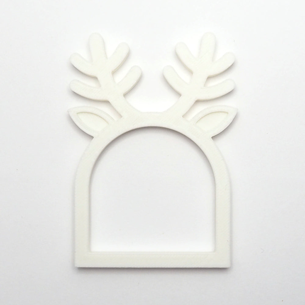 Hvid rensdyr servietring med gevirdetaljer, perfekt som juleservietring til borddækning. 