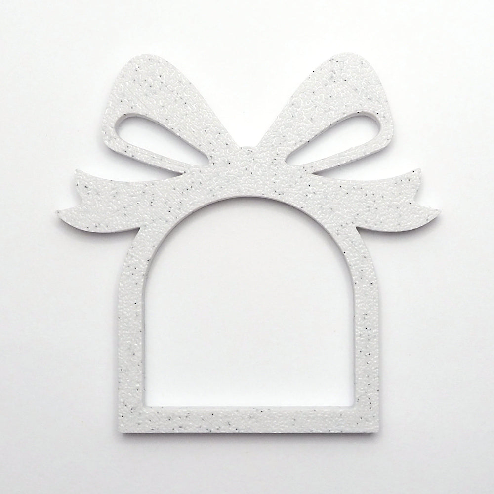 Marmorlook servietring med sløjfe design, perfekt til jule som juleservietring til borddækning. 